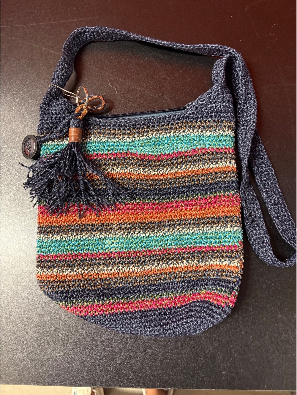 The Sak Crochet Crossbody Shoulder Bag with Tassel Accent